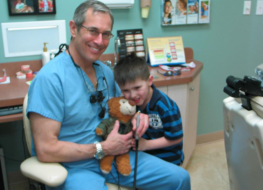 Dr. Brooks working with young boy