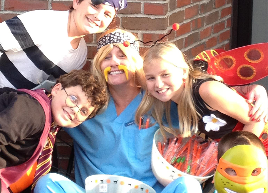 Dentist and kids dressed up for Halloween