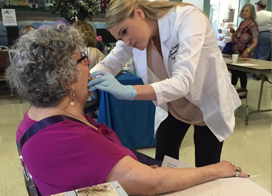 Dr. Stephanie Brooks working with older female patient