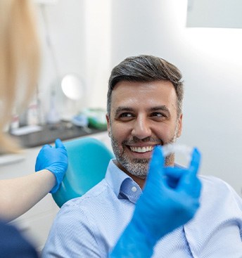 man getting a replacement tray after loss or damage