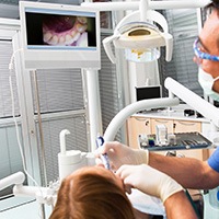 Dentist and patient looking at intraoral images