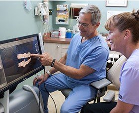 Dr. Brooks and patient in dental exam room