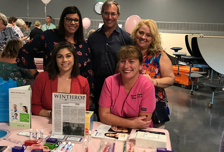 Dentists and team members at community event