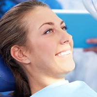 Smiling woman in dental chair