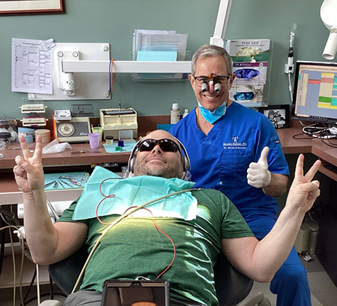 woman lying in bed recovering from implant placement