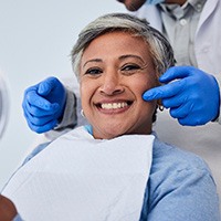 woman smiling after getting her teeth checked