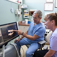 Dr. Brooks and patient looking at digital smile design