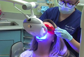 Patient receiving teeth whitening