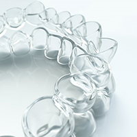 Closeup of Invisalign in Winthrop aligners on white background