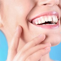 woman smiling with a gap in her front teeth