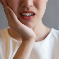 woman with a misaligned bite needing Invisalign in Winthrop 