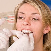 Dentist checking fit of Invisalign tray