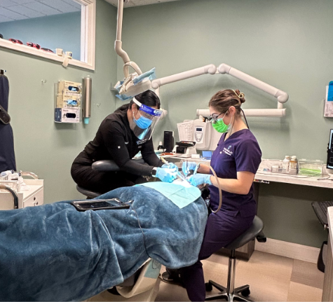 Dr. Brooks working on a patient