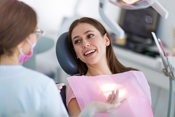 Dental patient speaks to dentist