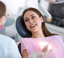 Dental patients speaks to dentist