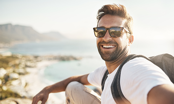 Selfie of a smiling man on the beach
