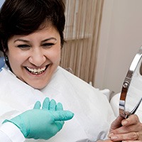 Smiling older woman in dental chair