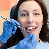 Woman receiving dental exam