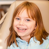 Smiling little girl in dental chair