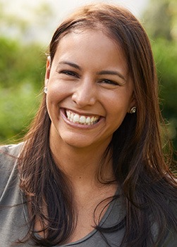 Young woman smiling outdoors