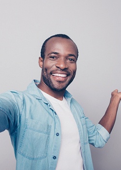 man smiling after getting teeth whitening in Winthrop