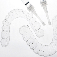 upper and lower teeth whitening trays and two applicators for solution, zoom teeth whitening Melrose, MA cosmetic dentistry