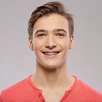 smiling young man with braces 