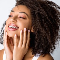 woman smiling with traditional braces 