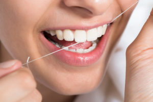 woman flossing