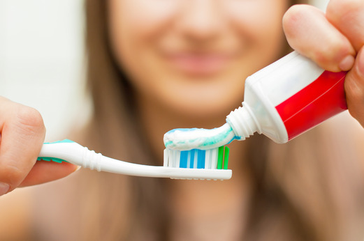 person brushing their teeth