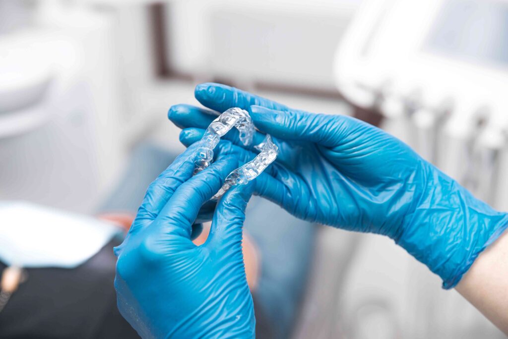 Dentist holding Invisalign