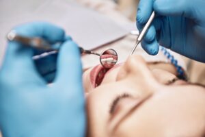 dental exam going on inside a patient’s mouth